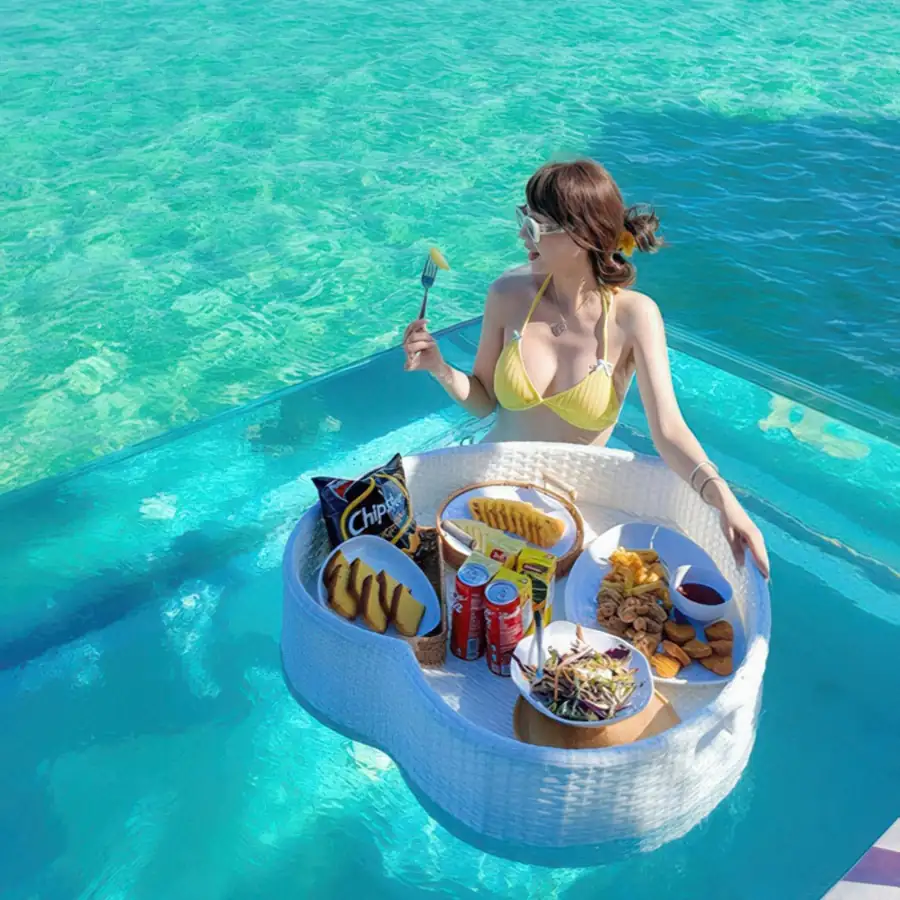 Guests enjoying the relaxing atmosphere on the overwater deck Cupid Resort