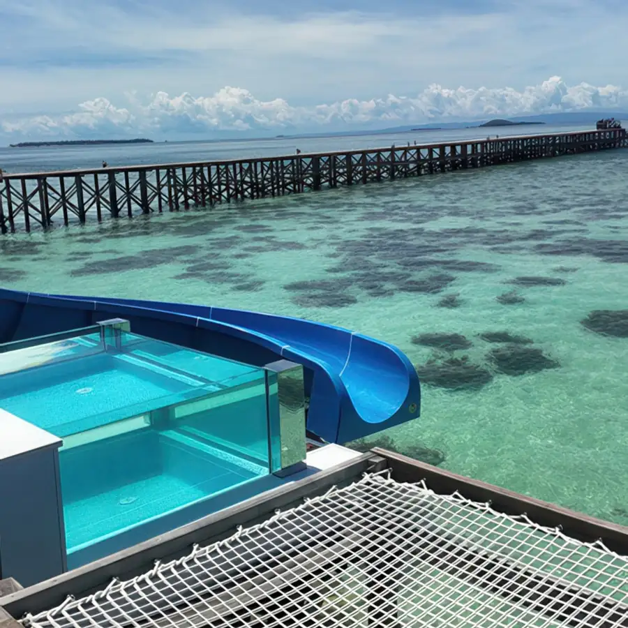 Private balcony featuring a glass-front pool and outdoor bathtub at Cupid Resort, an intimate overwater haven near Semporna.